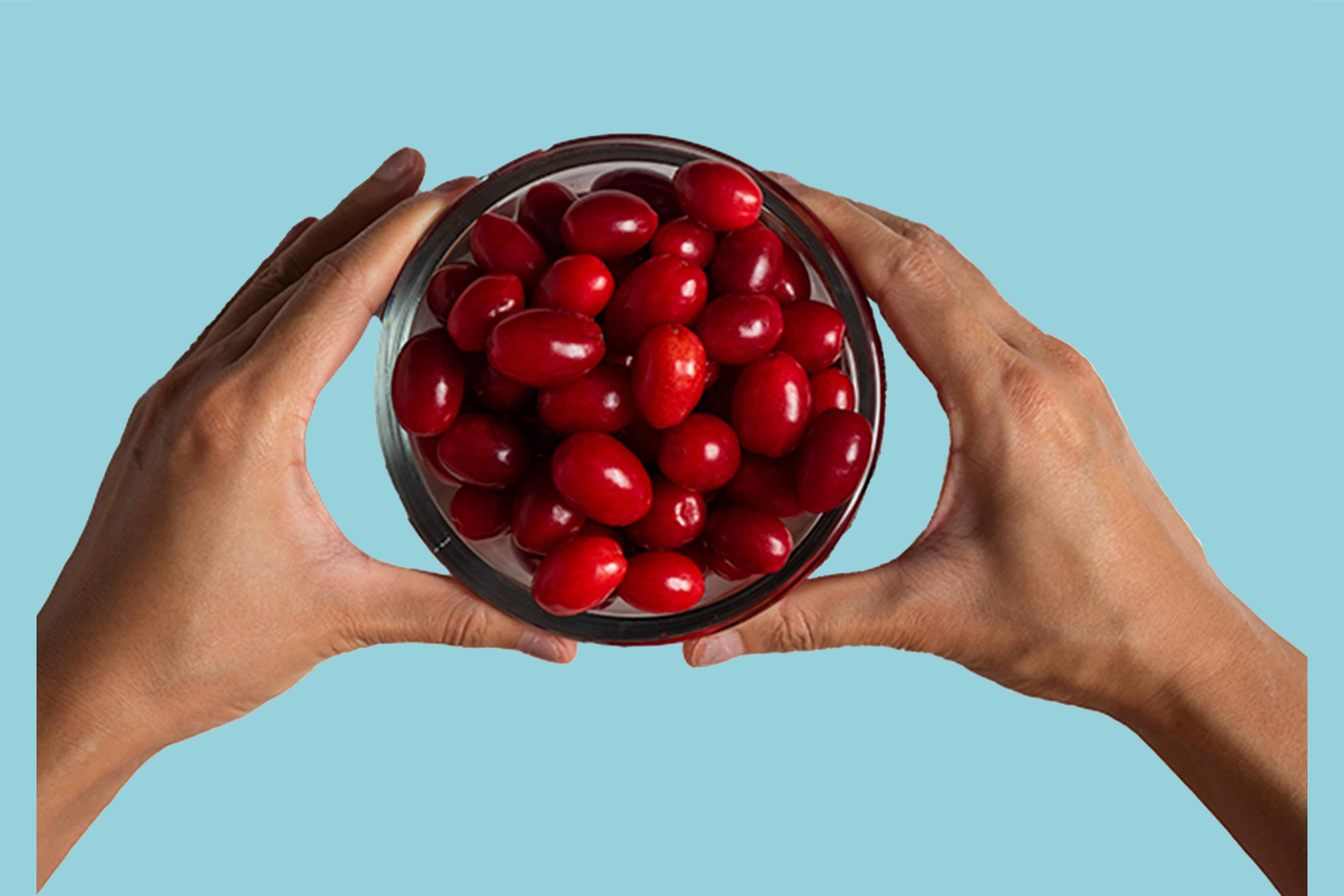 Hands holding cranberies. Benzoic acid is salt of benzoic acid is a food-grade preservative.Benefit: preserves freshness naturally.