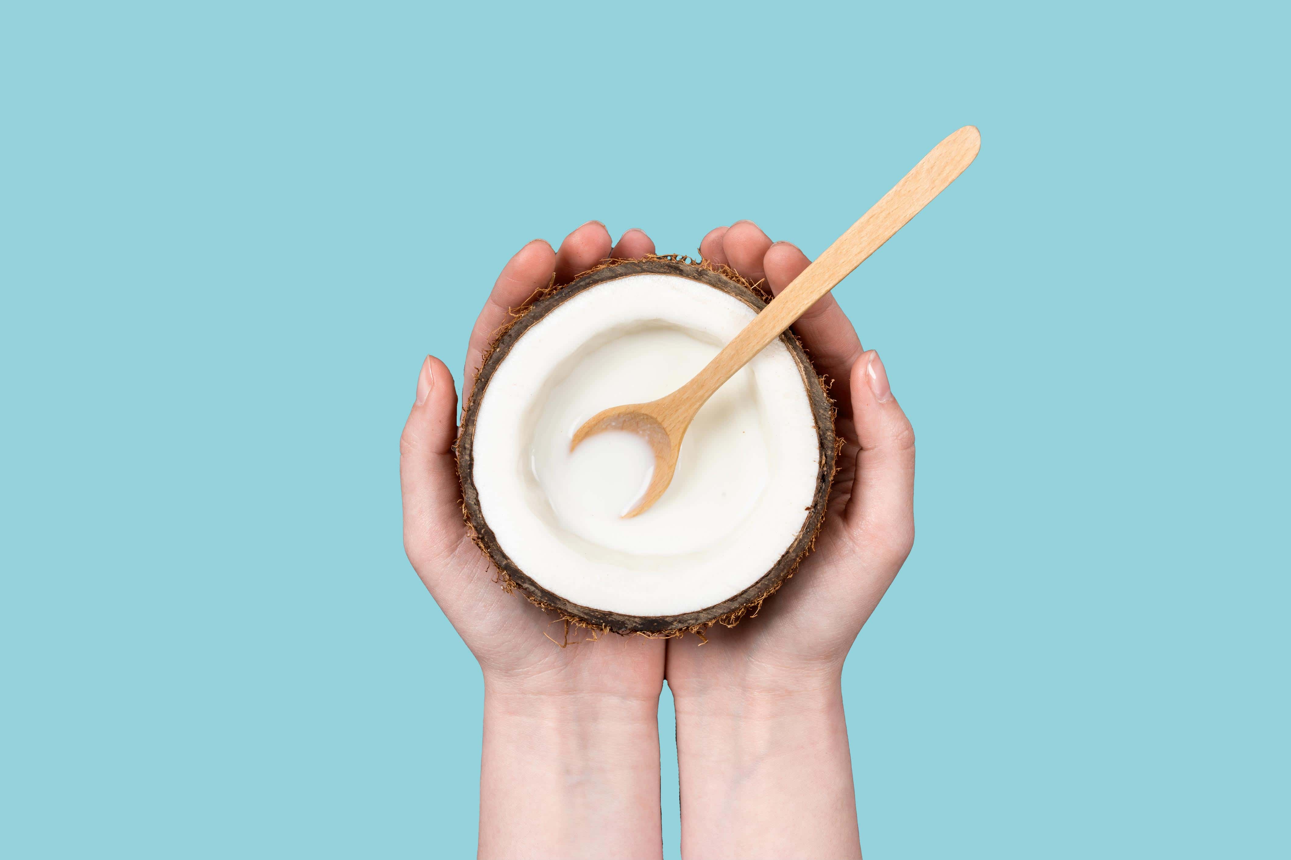 Hands holding coconut with milk in it. Sourced from fresh coconut milk.Benefits: Nourishes and hydrates hair and skin, leaving a silky, soft finish while balancing moisture.