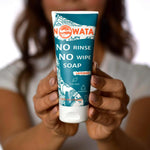 Yalda holding bottle of no rinse no wipe soap NOWATA